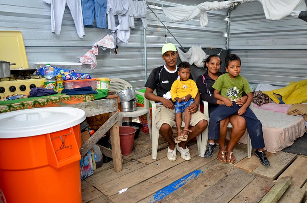 Dastin and his family in their new home